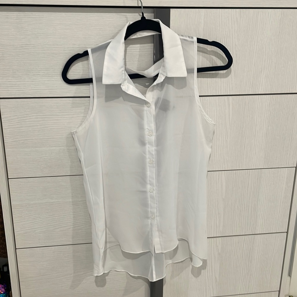 Two Bebe blouses sleeveless white new without tag.